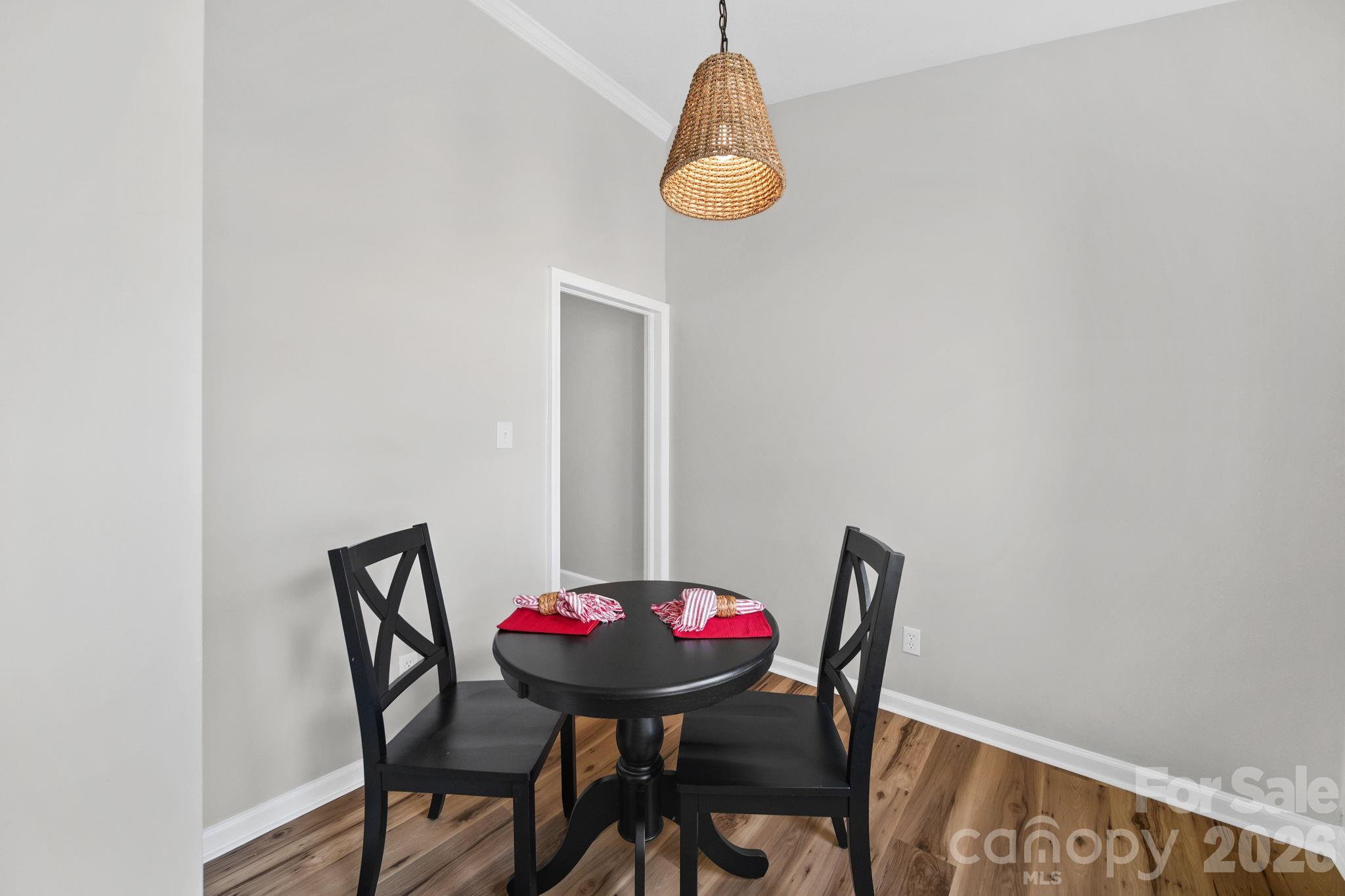 196 Spruce Street Badin, NC 28009 - Photo 16 of 43 a view of a dining room with a table and chairs