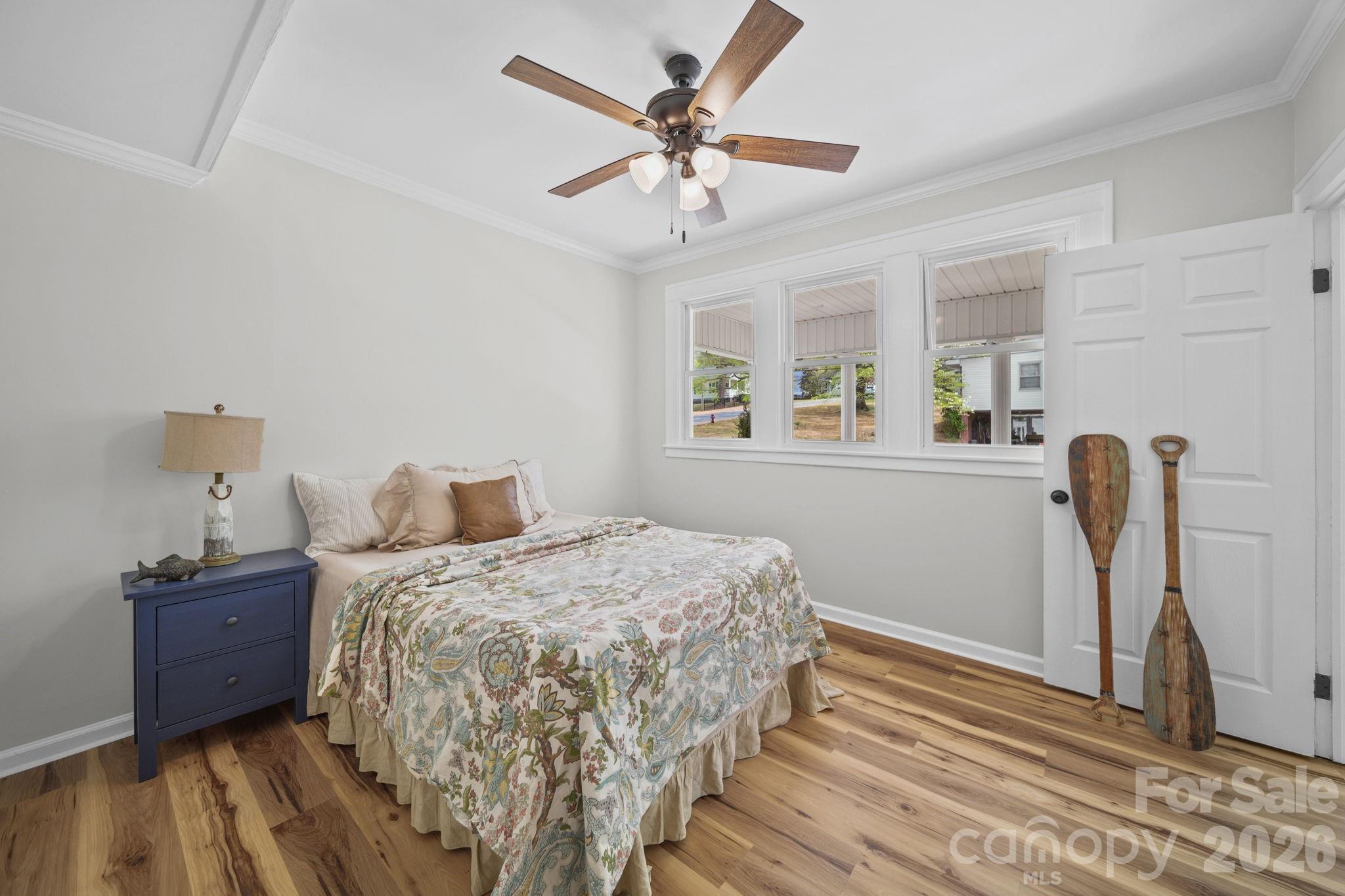 196 Spruce Street Badin, NC 28009 - Photo 20 of 43 a bedroom with bed and window