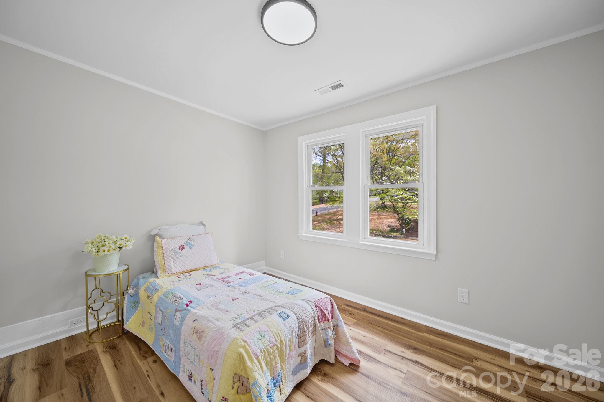 196 Spruce Street Badin, NC 28009 - Photo 25 of 43 a bedroom with a bed and a window