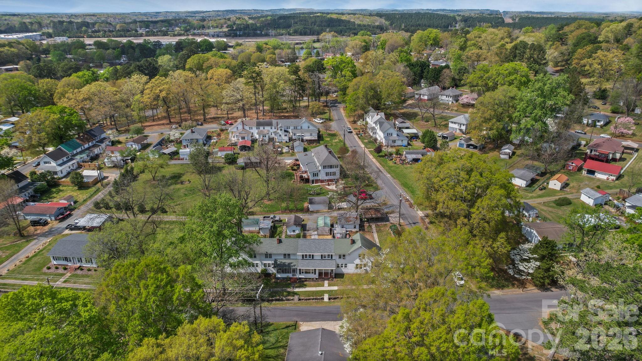 196 Spruce Street Badin, NC 28009 - Photo 38 of 43 an aerial view of residential building with outdoor space and trees