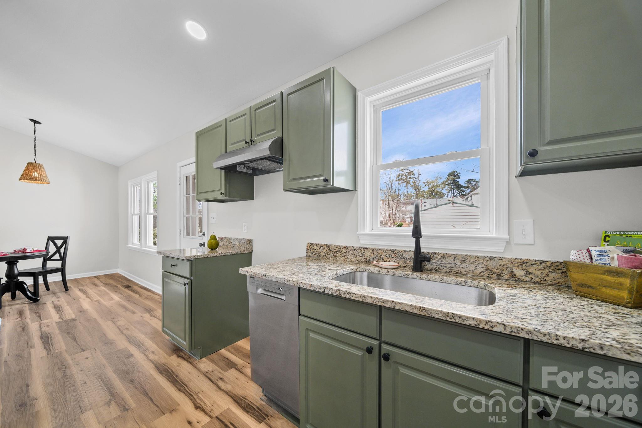 196 Spruce Street Badin, NC 28009 - Photo 10 of 43 a kitchen with sink cabinets and window