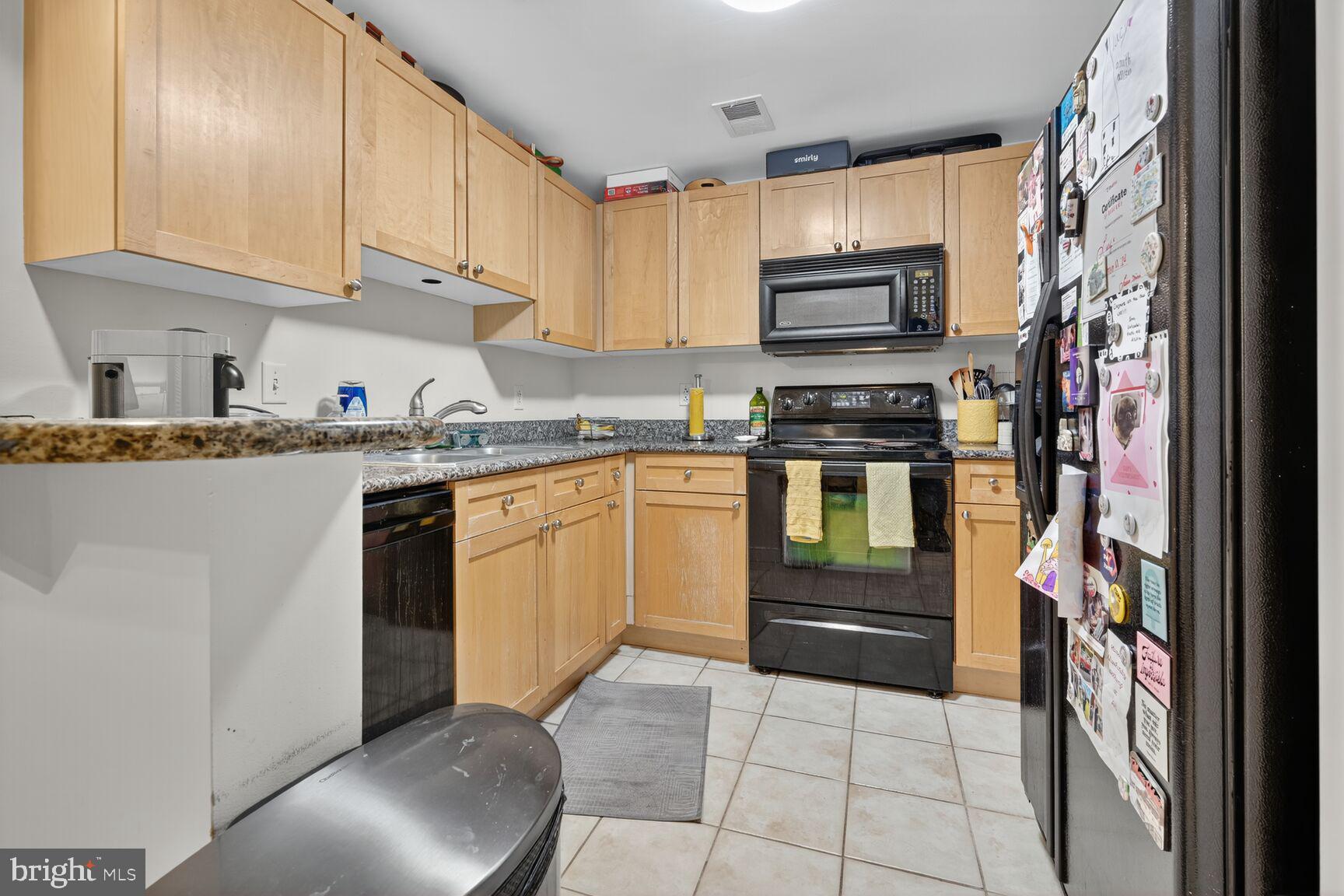777 7th Street Northwest, Unit 526 Washington, DC 20001 - Photo 15 of 24 a kitchen with stainless steel appliances granite countertop a stove sink and cabinets