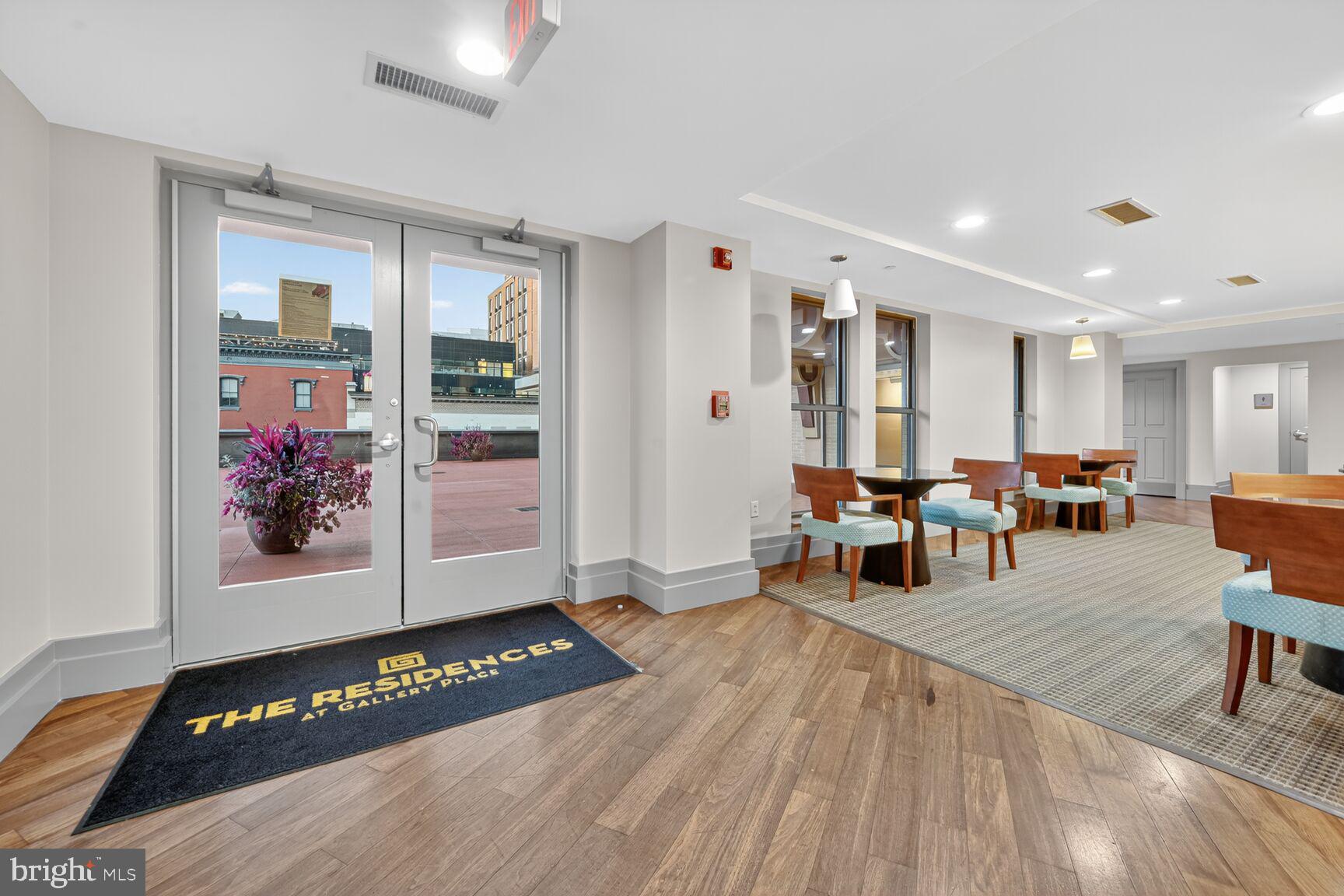 777 7th Street Northwest, Unit 526 Washington, DC 20001 - Photo 18 of 24 a view of a livingroom with furniture and wooden floor
