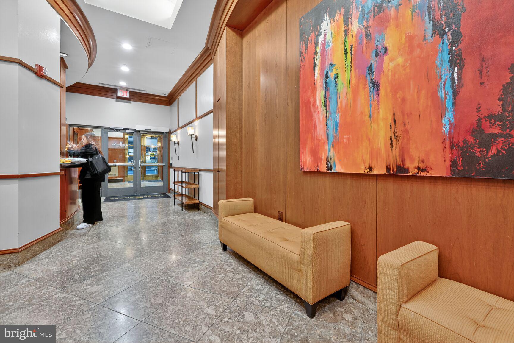 777 7th Street Northwest, Unit 526 Washington, DC 20001 - Photo 23 of 24 a living room with furniture and a flat screen tv