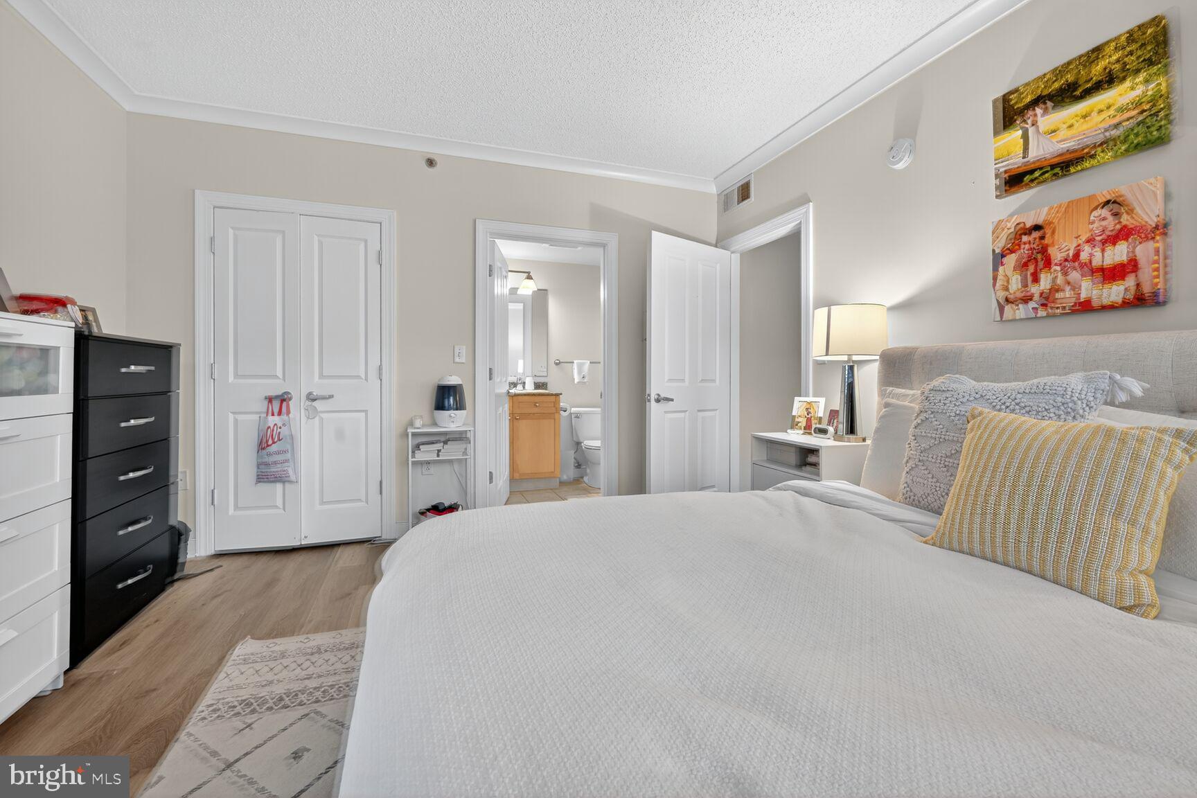 777 7th Street Northwest, Unit 526 Washington, DC 20001 - Photo 6 of 24 a large bedroom with a bed and a couch