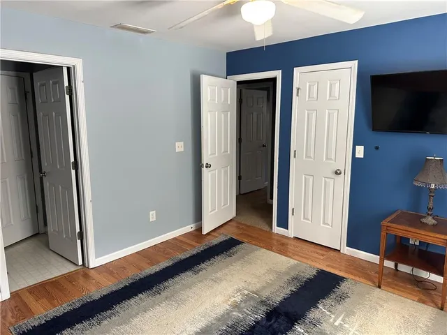 a bedroom with a bed and a television