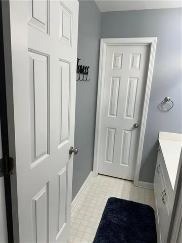 a bedroom with a bed and a mirror