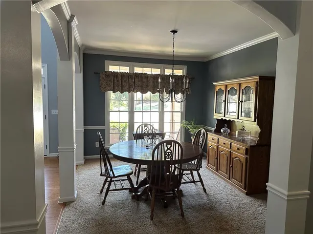a view of a dining room with furniture window and outside view
