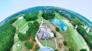 an aerial view of a house with outdoor space