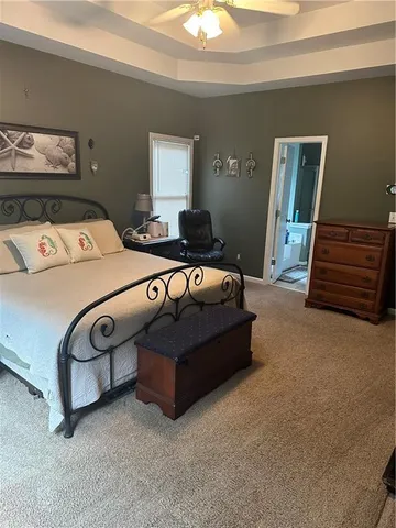 a bed room with a bed and a dresser