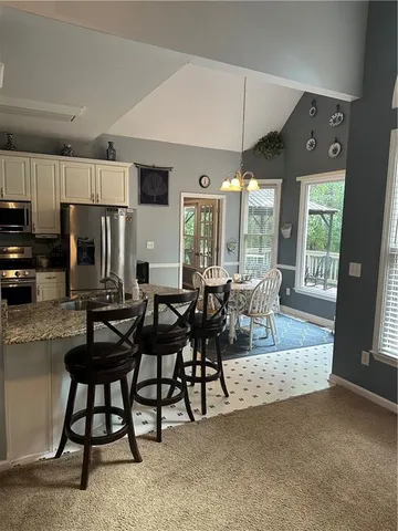 a view of a livingroom with furniture and window