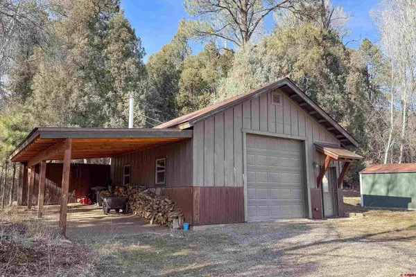 a house with trees in the background