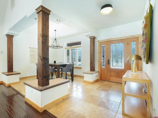 a view of a dining room with furniture window and outside view