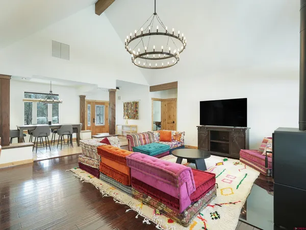 a bedroom with bed and wooden floor