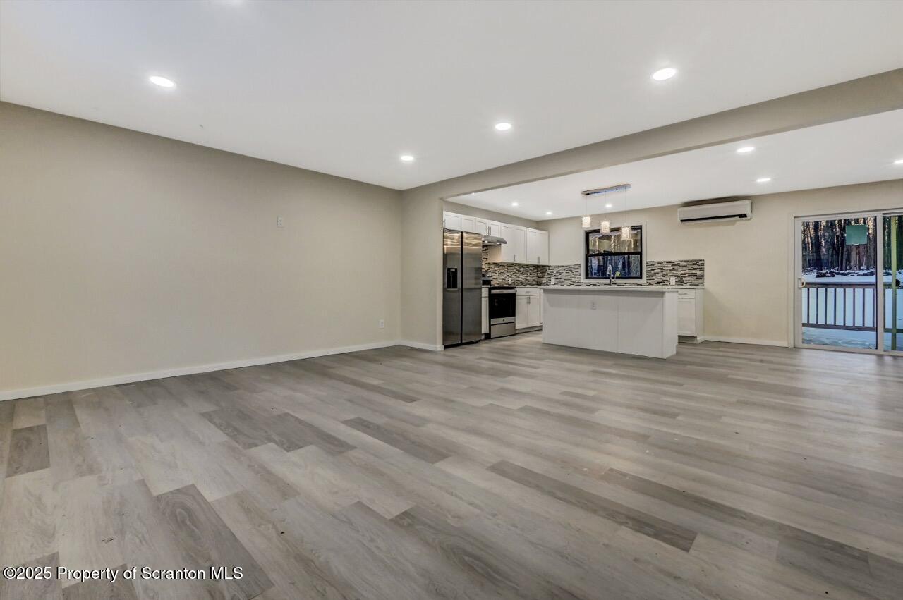 71 Sandy Beach Road Gouldsboro, PA 18424 - Photo 13 of 57 a view of a kitchen with a sink and a refrigerator
