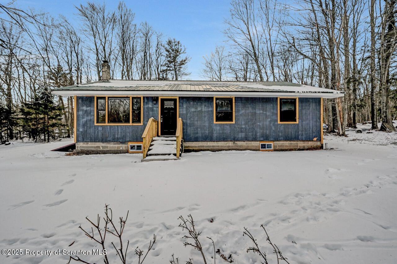 71 Sandy Beach Road Gouldsboro, PA 18424 - Photo 2 of 57 a house view with a outdoor space