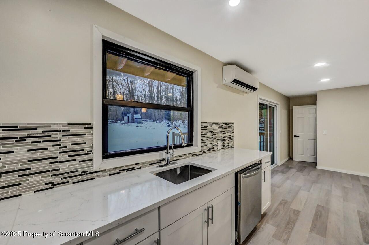 71 Sandy Beach Road Gouldsboro, PA 18424 - Photo 23 of 57 a kitchen with a sink and a stove top oven