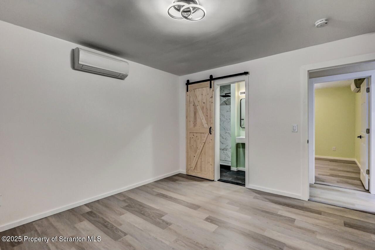 71 Sandy Beach Road Gouldsboro, PA 18424 - Photo 32 of 57 an empty room with wooden floor