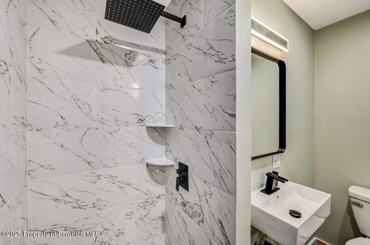 71 Sandy Beach Road Gouldsboro, PA 18424 - Photo 34 of 57 a bathroom with a sink and mirror