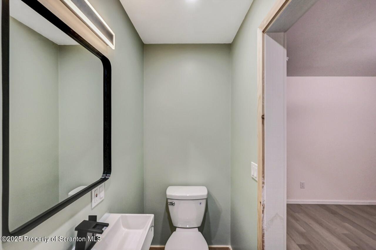 71 Sandy Beach Road Gouldsboro, PA 18424 - Photo 35 of 57 a bathroom with a toilet and a mirror