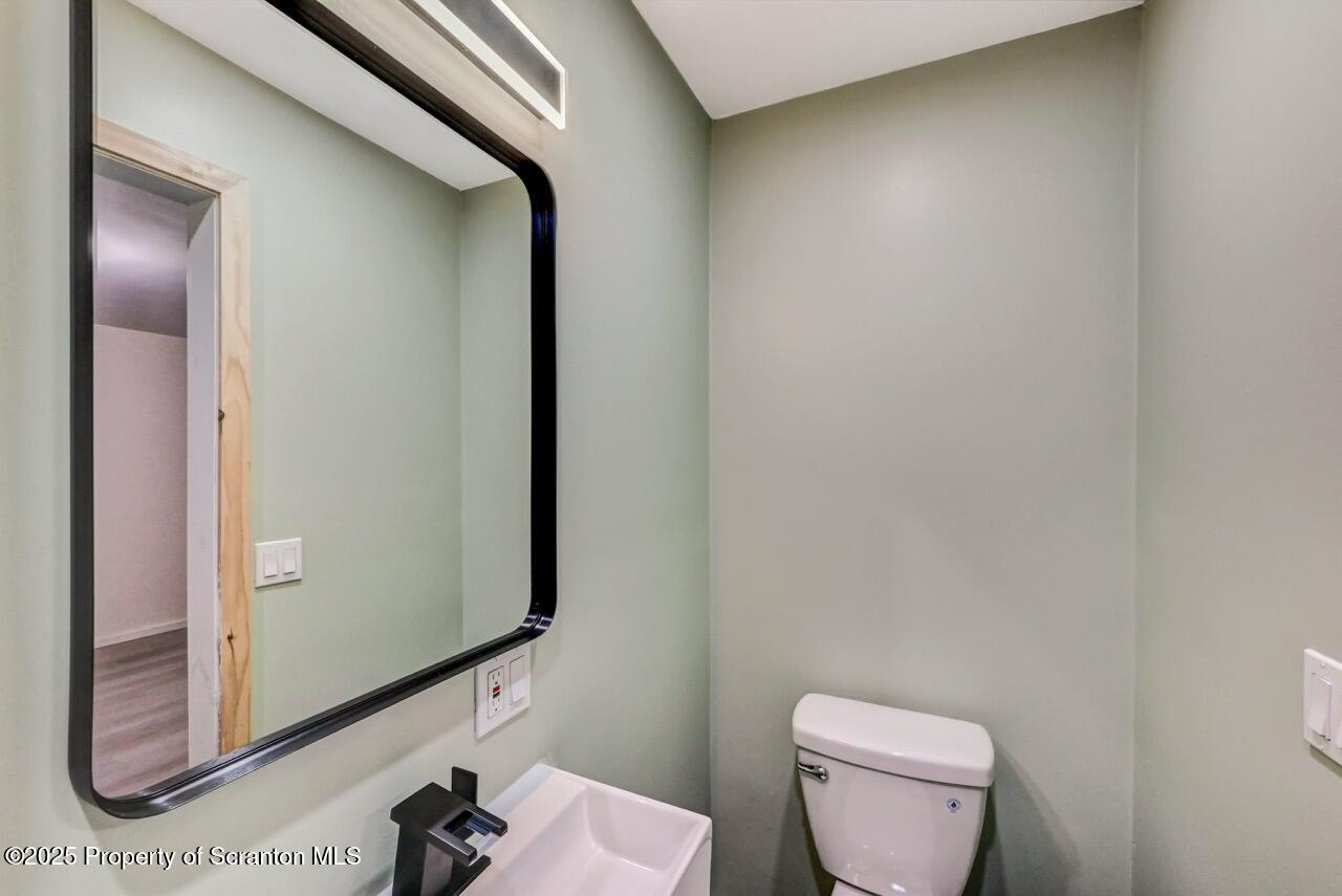 71 Sandy Beach Road Gouldsboro, PA 18424 - Photo 36 of 57 a bathroom with a toilet and a mirror
