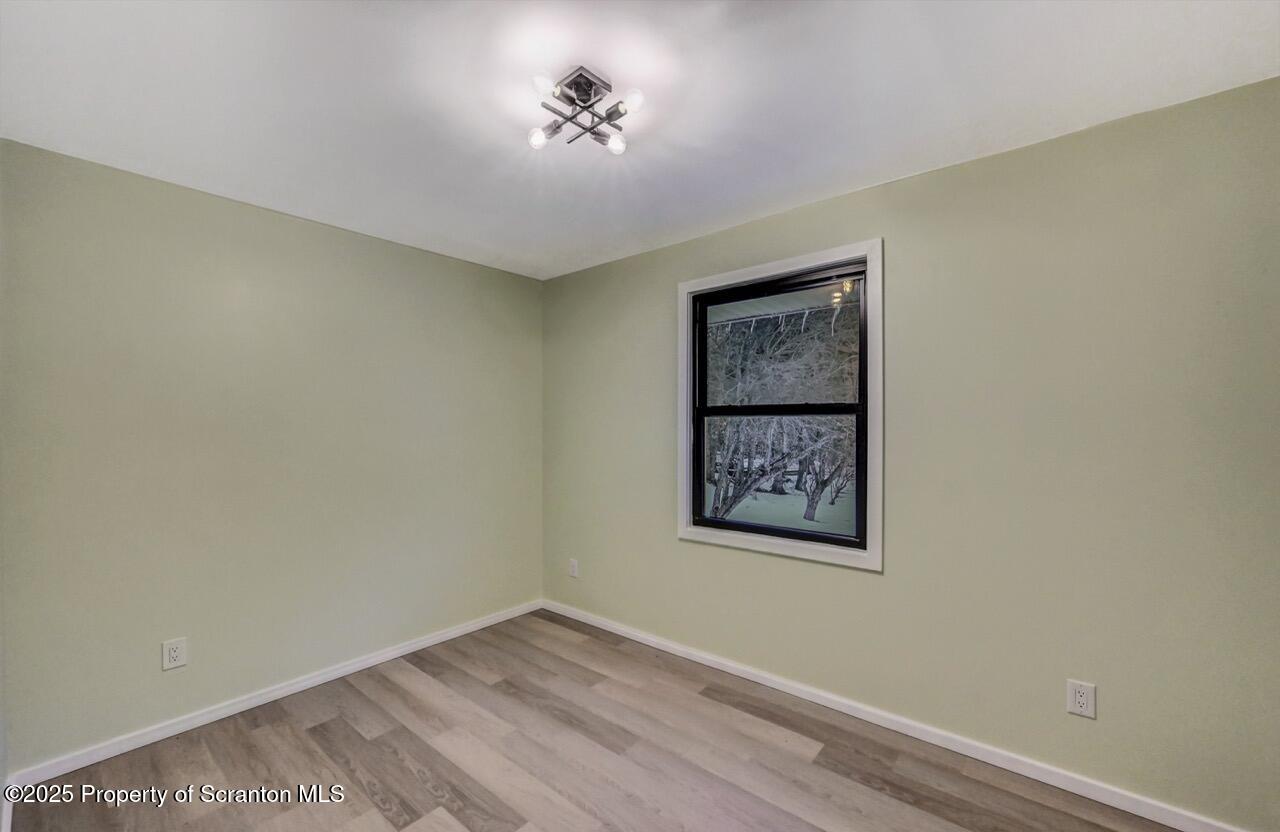 71 Sandy Beach Road Gouldsboro, PA 18424 - Photo 38 of 57 an empty room with a painting on the wall