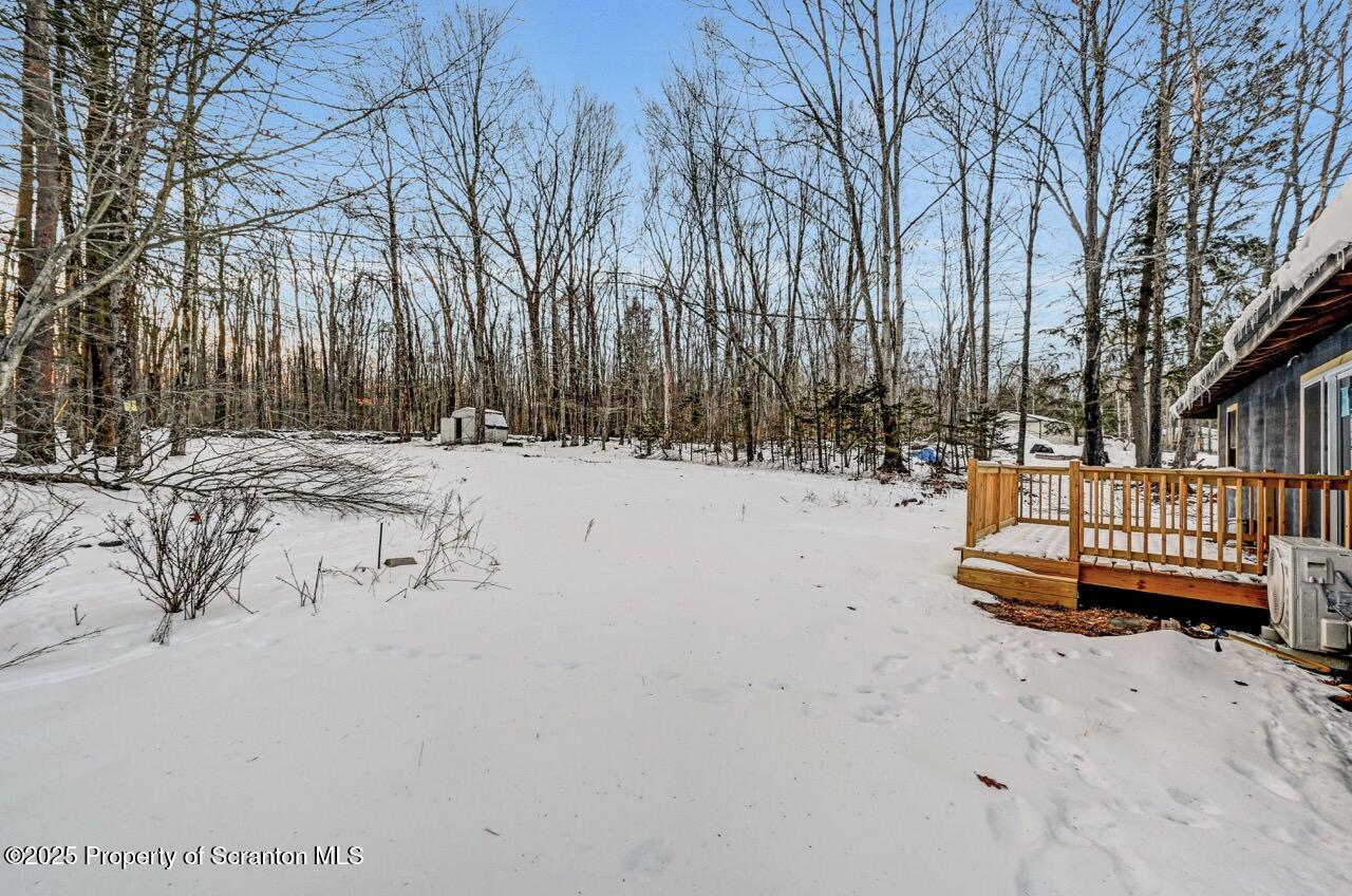 71 Sandy Beach Road Gouldsboro, PA 18424 - Photo 4 of 57 a view of backyard with a deck