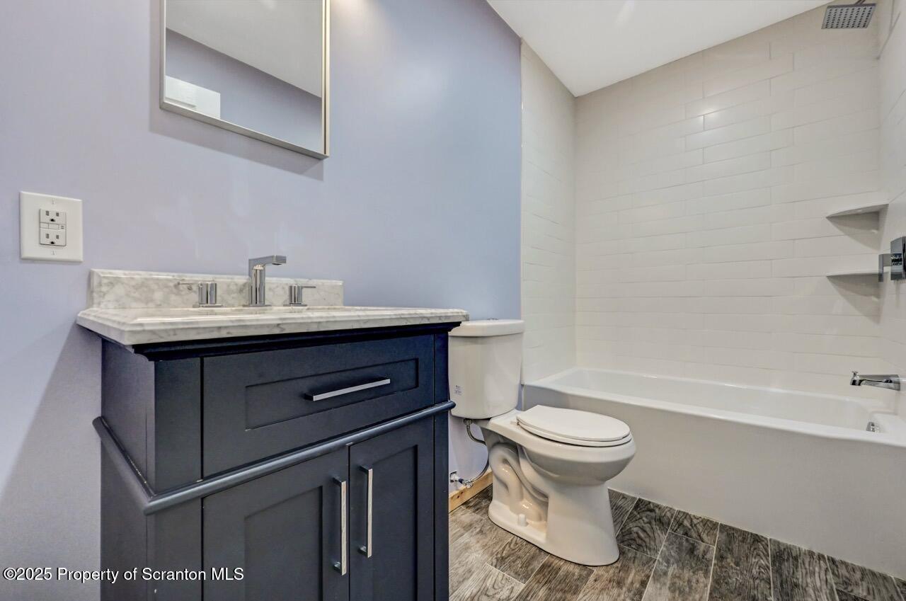 71 Sandy Beach Road Gouldsboro, PA 18424 - Photo 41 of 57 a bathroom with a sink toilet and a bathtub