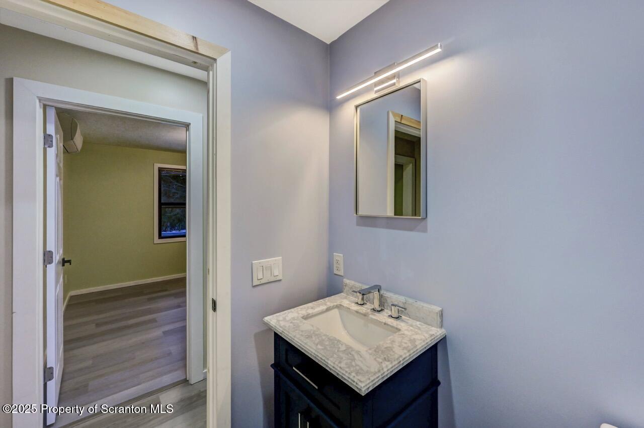 71 Sandy Beach Road Gouldsboro, PA 18424 - Photo 42 of 57 a bathroom with a sink and a mirror