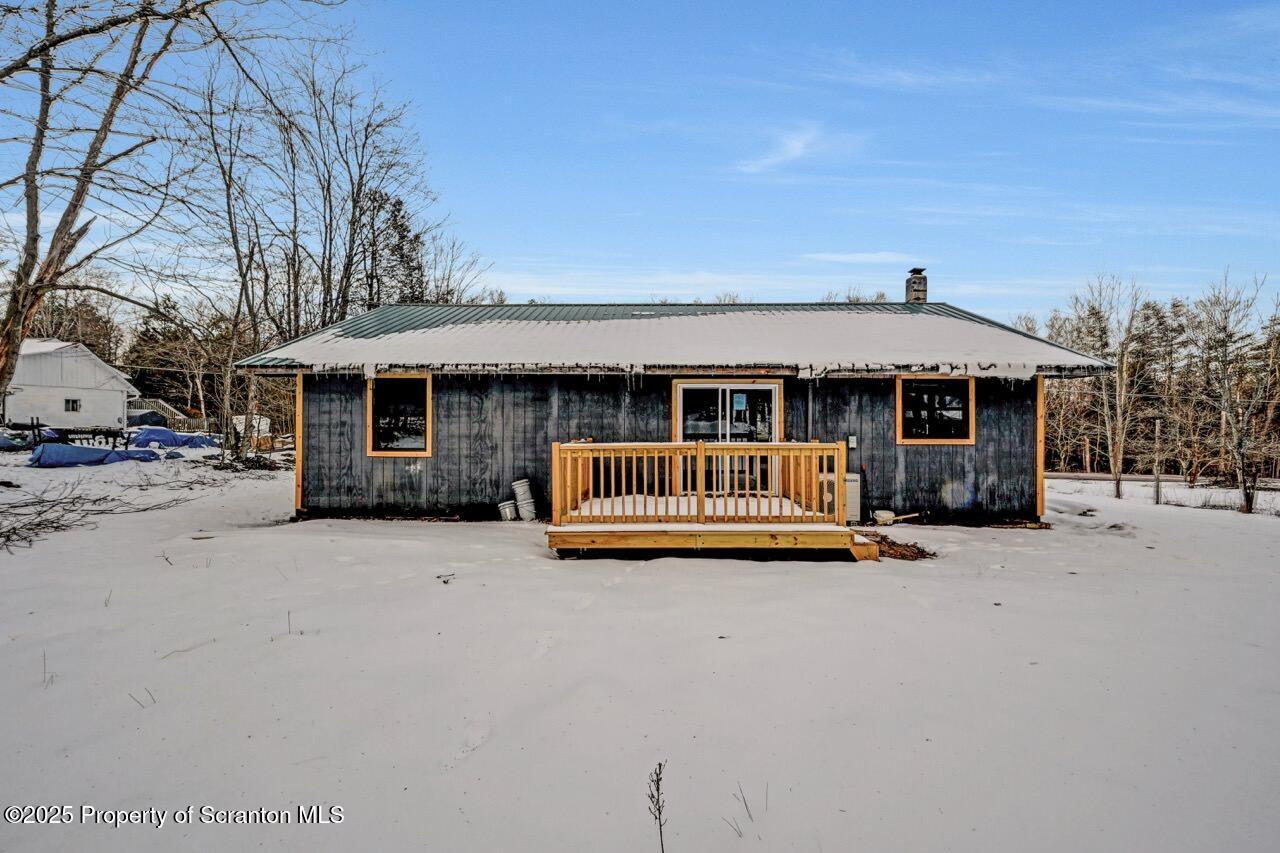 71 Sandy Beach Road Gouldsboro, PA 18424 - Photo 5 of 57 a view of a house with a patio