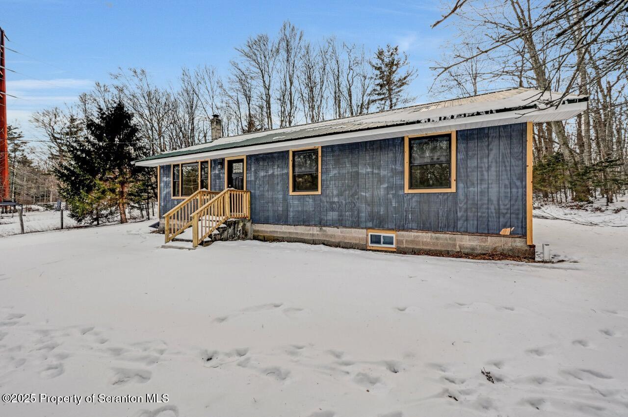 71 Sandy Beach Road Gouldsboro, PA 18424 - Photo 52 of 57 a view of a house with a patio