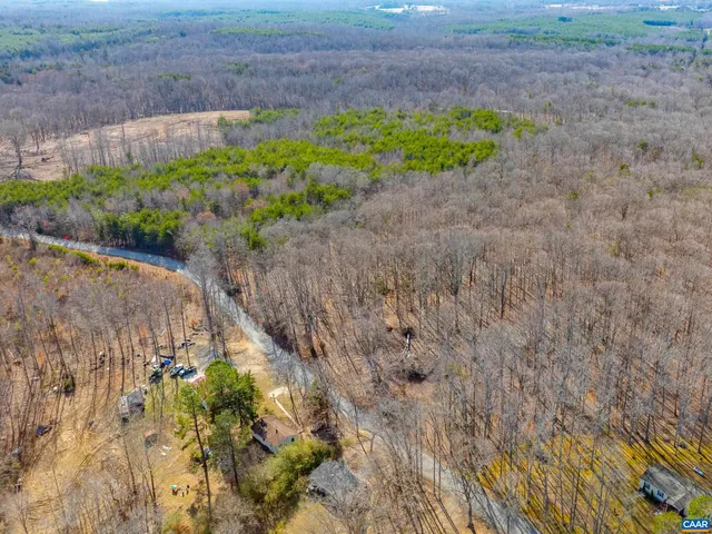 a view of a field with an ocean