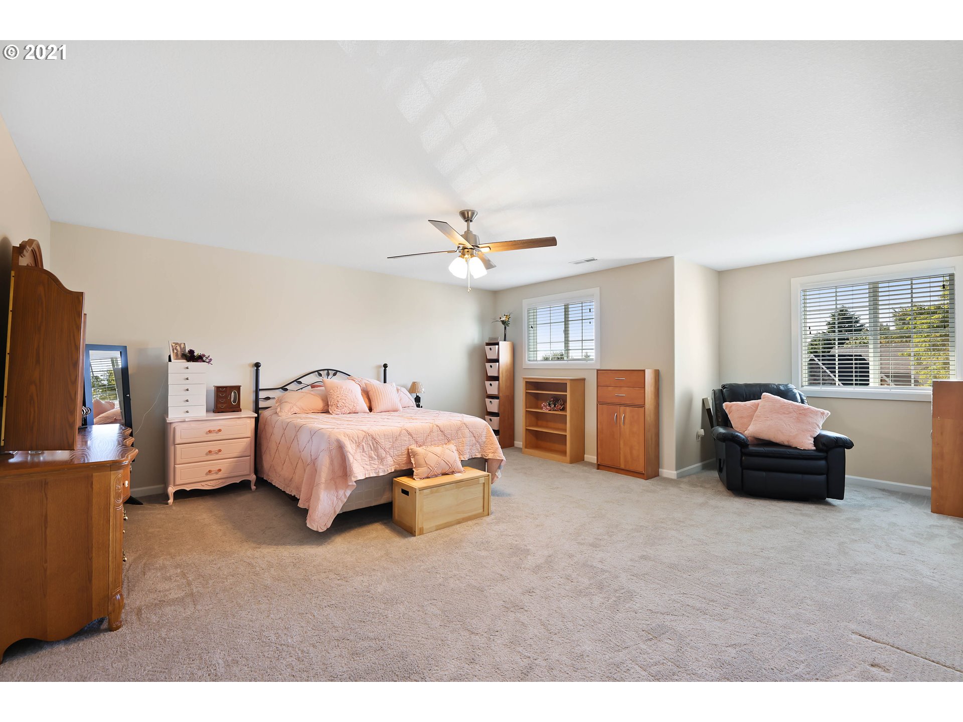 907 North 9th Way Ridgefield, WA 98642 - Photo 22 of 32 a bedroom with a bed and a chandelier