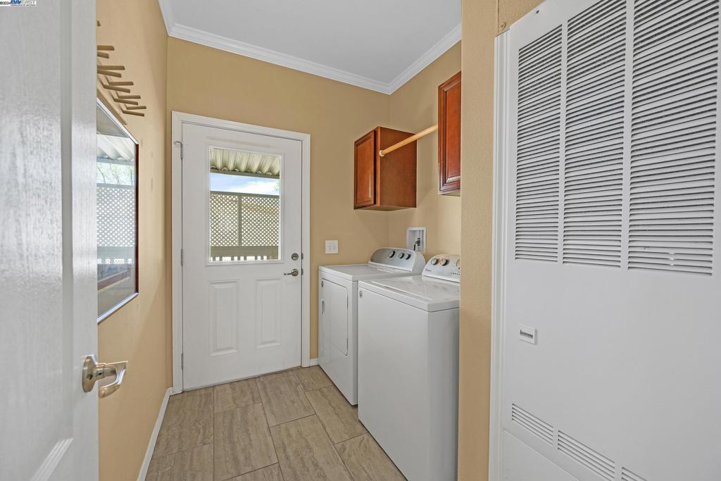 3263 Vineyard Avenue Pleasanton, CA 94566 - Photo 4 of 14 a bathroom with a sink a mirror and shower