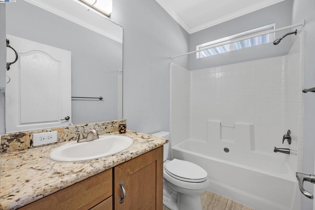 3263 Vineyard Avenue Pleasanton, CA 94566 - Photo 8 of 14 a bathroom with a granite countertop sink toilet and shower