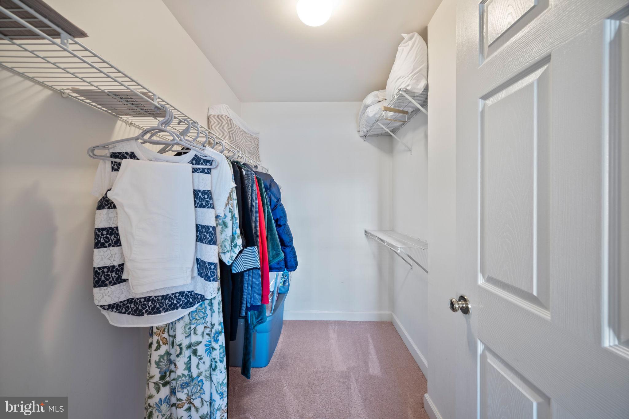 2322 Falls Gable Lane, Unit N Baltimore, MD 21209 - Photo 18 of 44 a view of walk in closet with clothes