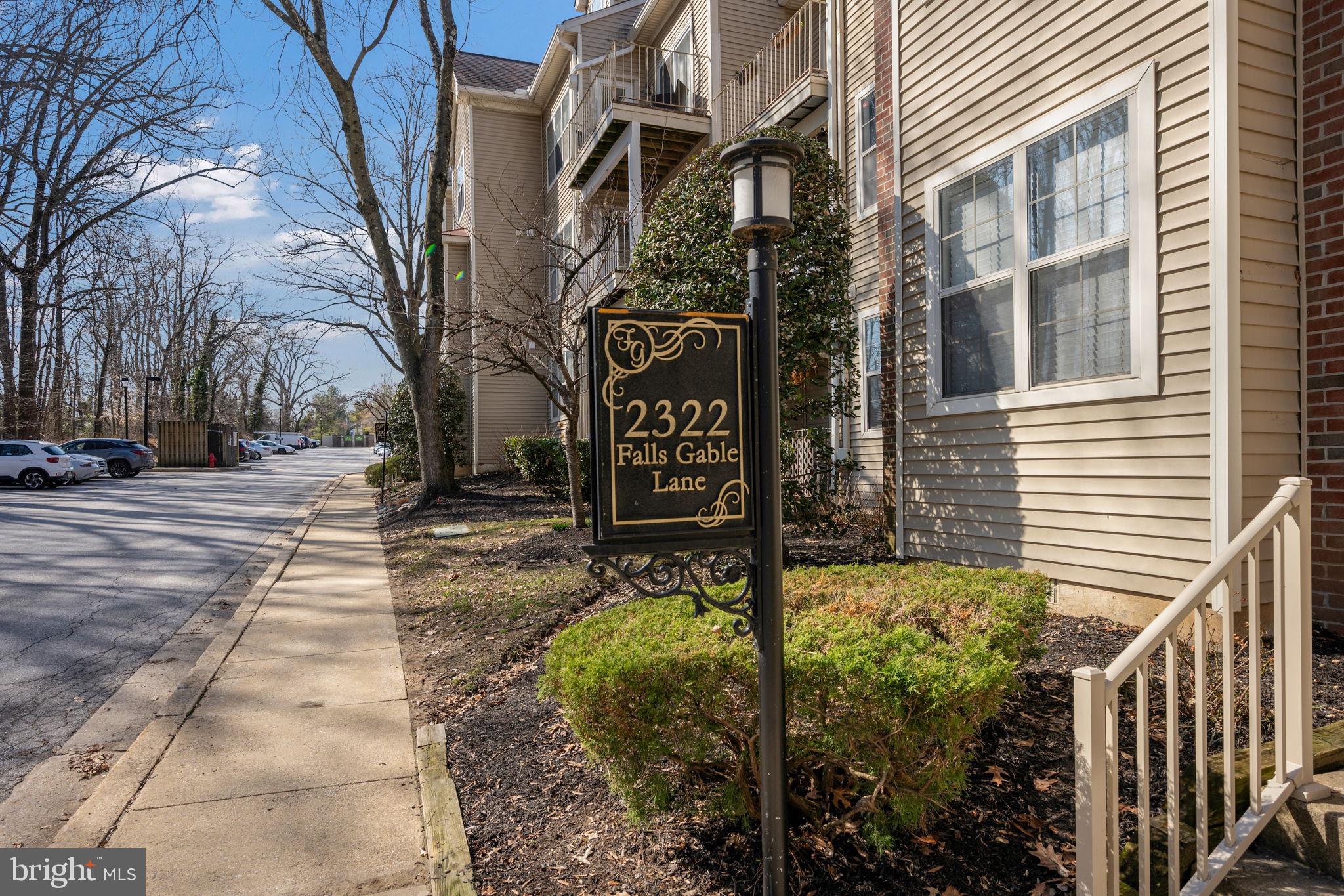 2322 Falls Gable Lane, Unit N Baltimore, MD 21209 - Photo 2 of 44 a sign on the side of a building