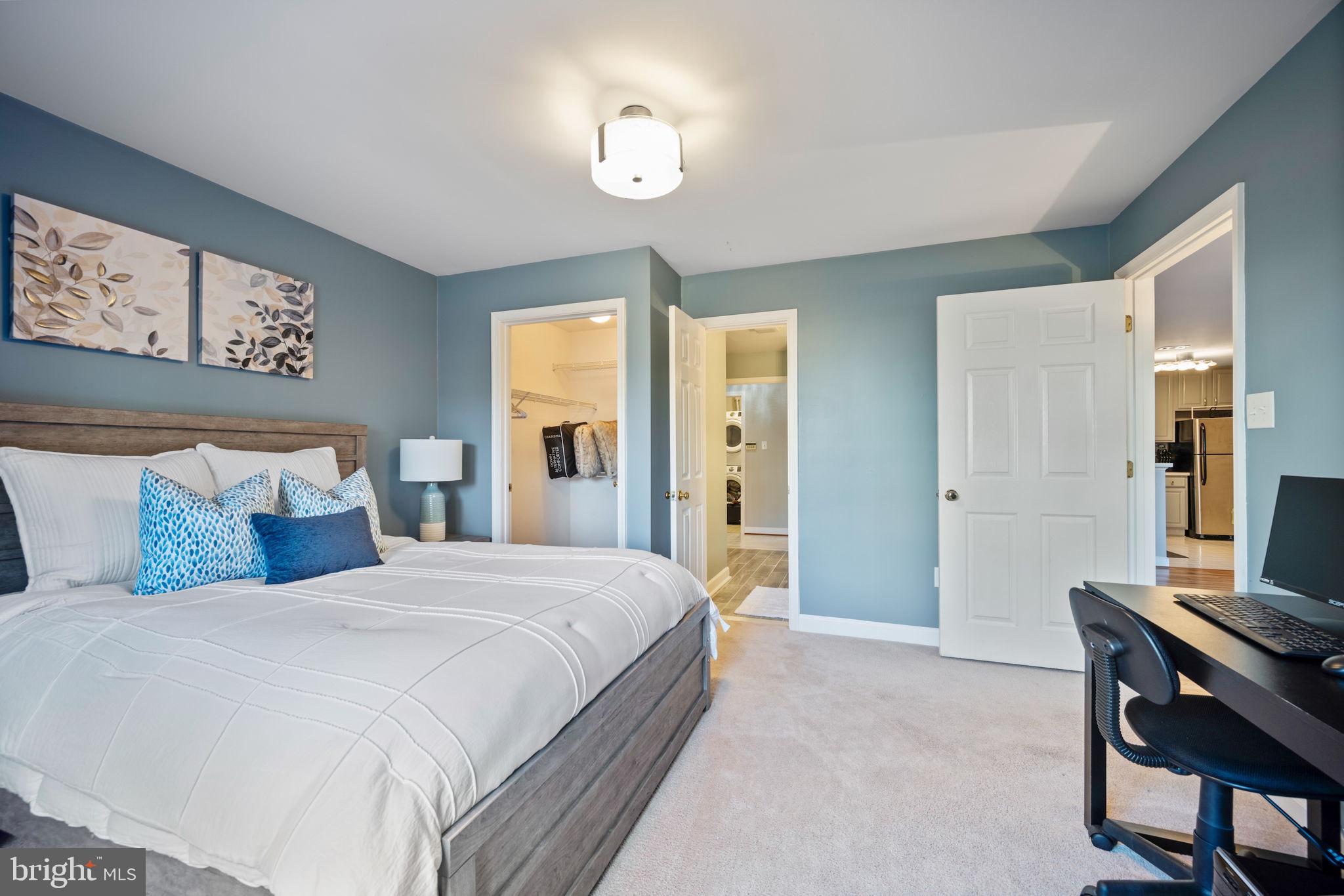 2322 Falls Gable Lane, Unit N Baltimore, MD 21209 - Photo 22 of 44 a bedroom with a bed and a table