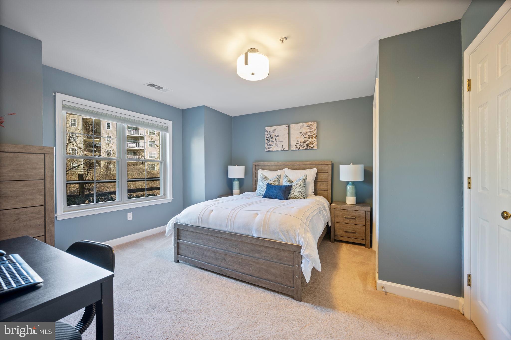 2322 Falls Gable Lane, Unit N Baltimore, MD 21209 - Photo 23 of 44 a bedroom with a bed and window