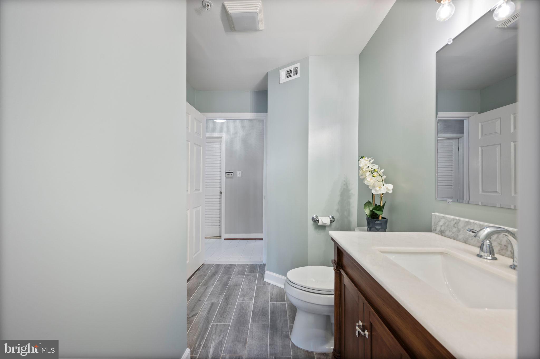 2322 Falls Gable Lane, Unit N Baltimore, MD 21209 - Photo 25 of 44 a bathroom with a sink toilet and vanity