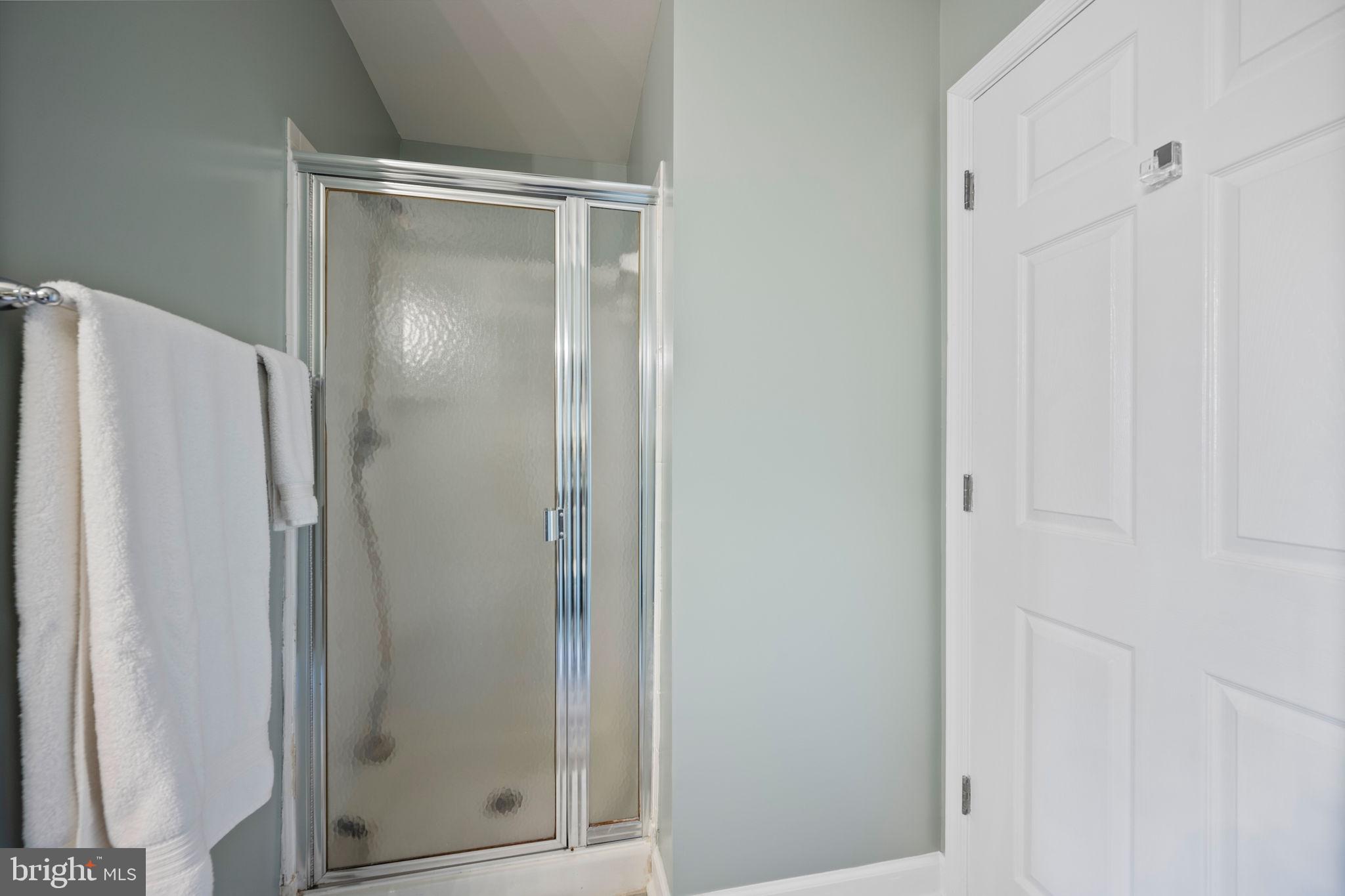 2322 Falls Gable Lane, Unit N Baltimore, MD 21209 - Photo 28 of 44 a bathroom with a glass shower door