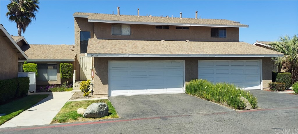 FRONT VIEW OF ENTRY AND 2 CAR GARAGE