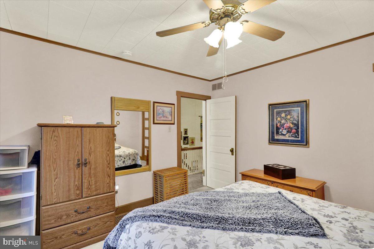 375 Sunset Road Reading, PA 19611 - Photo 12 of 23 a bedroom with a bed and a chandelier