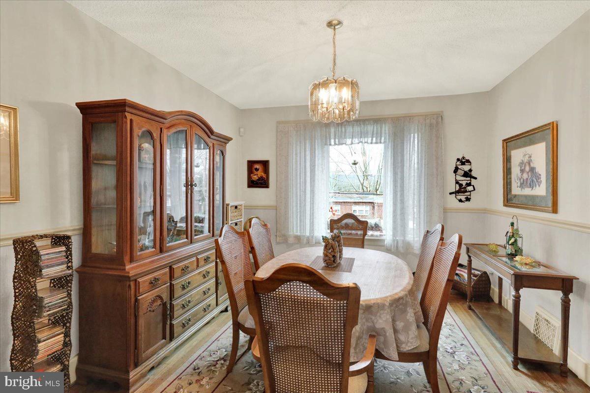 375 Sunset Road Reading, PA 19611 - Photo 4 of 23 a view of a dining room with furniture wooden floor and chandelier