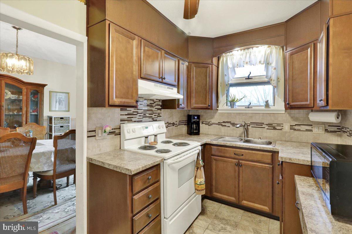 375 Sunset Road Reading, PA 19611 - Photo 6 of 23 a kitchen with a sink stove and cabinets