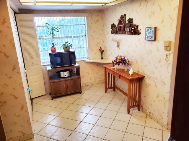 a kitchen with stainless steel appliances a stove a sink and a refrigerator