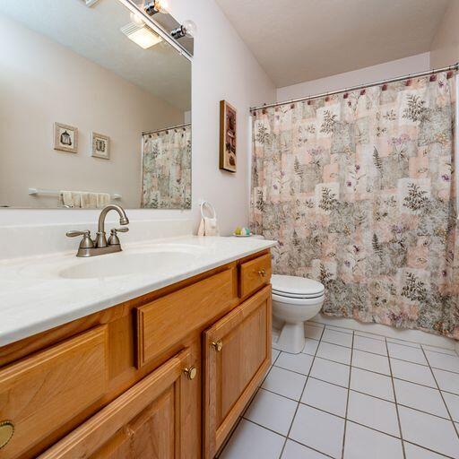 4 Red Cedar Road Mashpee, MA 02649 - Photo 15 of 25 a bathroom with a sink a toilet and mirror