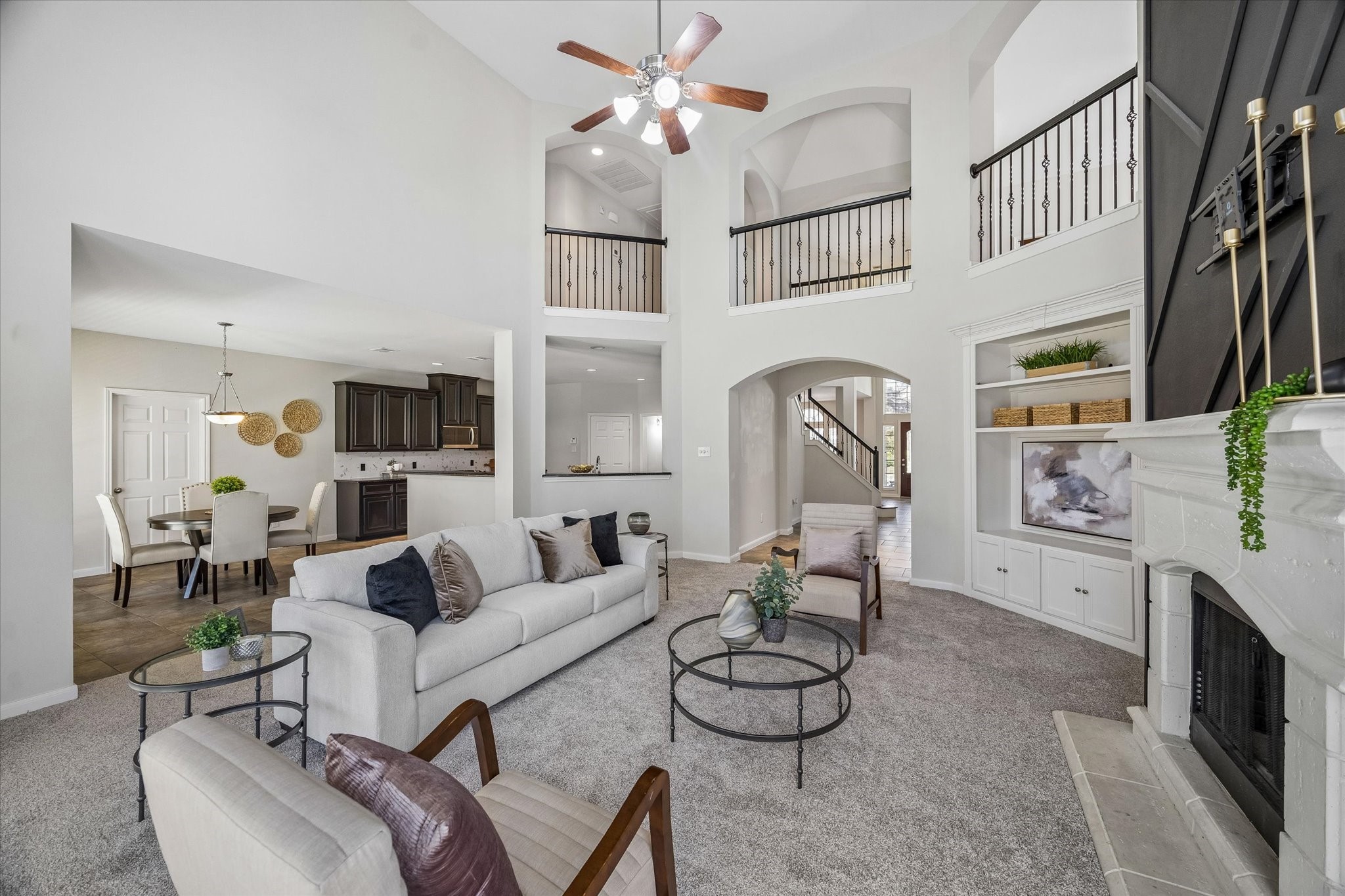 25827 Austin Springs Spring, TX 77373 - Photo 9 of 34 View from main living room leading into grand entryway. Notice the double height ceilings throughout creating a luxurious feel