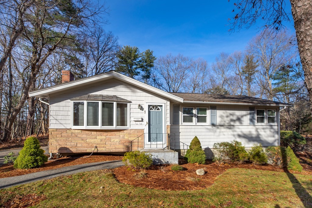 1 Spring Lane Sharon, MA 02067 - Photo 1 of 23 a front view of a house with garden