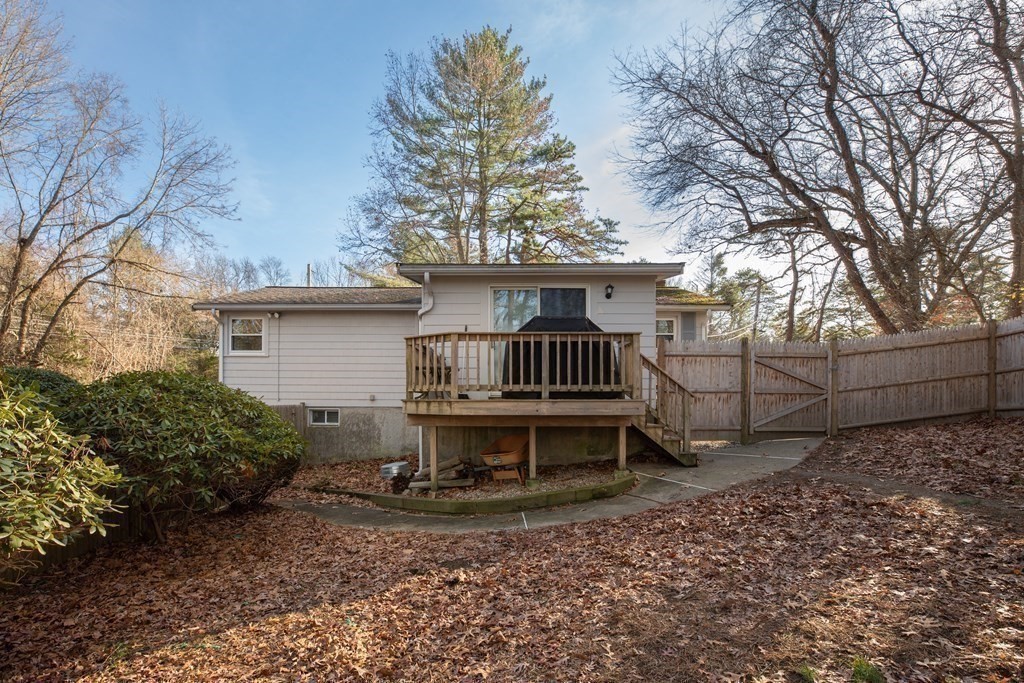 1 Spring Lane Sharon, MA 02067 - Photo 18 of 23 a view of a backyard with a barn and large trees
